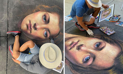 Талантливый мужчина рисует мелом на асфальте реалистичные портреты